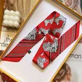 Foulard twilly in seta double-face con stampa zebrata e pois in una scatola arancione - Rosso