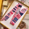 Detail of pink and blue vintage belt print silk scarf ribbon in a gift box - Pink and Blue Belt Buckle Style (S1860-1)