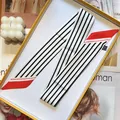 Elegant black and white striped silk scarf with red trim in a yellow gift box - White / 5x90cm