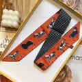 Orange horse print twilly scarf with black and white check pattern in a yellow gift box - Orange