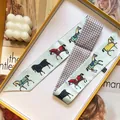 Elegant mint green horse print silk twilly scarf with checkered pattern in a gift box - Cyan