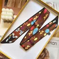 Detail of silk twilly scarf with cute fox and gingerbread man patterns in brown - Brown Fox (S291)