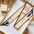 Detailed close-up of a 100% silk twilly scarf with cute cat illustration in a luxury gift box - Apricot Fox (S291)