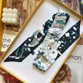Detailed view of luxury silk-like scarf with nautical motifs in a premium gift box - S975 / Black and Blue