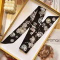 Detail of slim black silk scarf with vintage coins and cherry blossoms on a tray - S1845-5 / 5*90cm