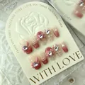 Pink and beige press-on nails with 3D bows, rhinestones, and pearls on a display card - L / 797 Pink Plaid Short Coffin