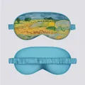 Detail of silk eye mask featuring Monet impressionist painting and light blue elastic band - View of Auvers