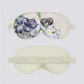 Detail of silk eye mask featuring Monet Water Lilies art print with elastic strap - Carnation