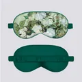 Front and back view of a luxury dark green silk sleep mask with artistic floral print - White Rose Pendant