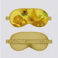 Detail showing front floral print and smooth satin reverse of Van Gogh sunflower eye mask - Sunflower