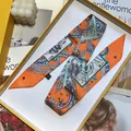 Elegant orange silk twilly scarf with playing card patterns in a luxury yellow gift box - Orange (S1156)