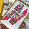Macro shot of red poker card pattern silk twilly scarf neatly placed in a yellow gift box - Rose Red (S1156)