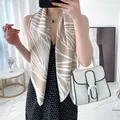 Elegant beige and white geometric leaf print faux silk scarf displayed on a model - Beige