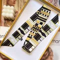 Elegant geometric print skinny silk scarf presented in a luxury gift box - Black