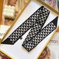 Narrow silk-like scarf featuring grey and black geometric triangle prints for hair and bags - Black