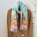 Floral print 100% mulberry silk scarf in light blue paired with a wool coat - 160x33cm / Sky Blue