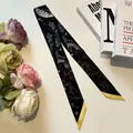 Detail of printed twilly silk scarf with animal sketches and yellow contrast borders - 80-100cm / Black