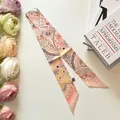 Peach pink twilly scarf with abstract hand-painted patterns on a minimalist desk - Orange Pink (S511)