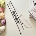 Minimalist white letter print ribbon scarf with elegant black border and silk texture - White