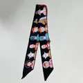 Black silk-style twilly scarf with cartoon illustrations and asymmetric diagonal ends - 80-100cm / Black