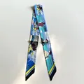 Twilly silk scarf featuring vintage comic resort scenes and colorful beach print pattern - Blue