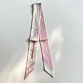 Silk twilly scarf with pink horse bits print and white polka dots on a white background - Pink