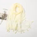Elegant beige lace scarf with tassels, floral embroidery, and a soft chiffon texture - Beige