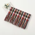 Detailed view of winter checkered scarf with long tassels and soft cashmere texture - Dark Red And Black