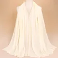 Elegant cream chiffon hijab scarf featuring shimmering golden rhinestones and beaded edges - Beige