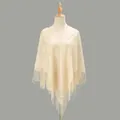 Close-up of the delicate hollow floral lace and tassel fringe on the ivory shawl - Beige / 185-72cm