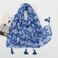 Detailed view of royal blue floral scarf with white daisy print and elegant fringe tassels - Royal Blue Base White Flower Style (XB957)