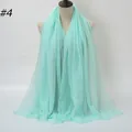 Mint green crinkled cotton shawl with raw fringe edges shown on a beige mannequin - 180x90cm / Mint Green (4#)