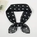 Detailed close-up of lightweight chiffon neck scarf with classic black and white polka dots - Black and White
