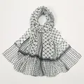 Close-up of geometric chiffon scarf featuring black lattice patterns and wavy edge details - 180*70cm / YW313-Black