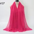 Magenta pleated cotton linen scarf with frayed edges displayed on a white mannequin - 180x90cm / Magenta (#37)