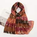 Detail of vintage floral print scarf with orange and brown stripes on white background - Orange and Caramel