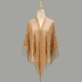 Detail of vintage hollow lace pattern and long tassels on a camel-colored shawl - Camel
