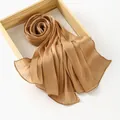 Elegant champagne gold pleated silk scarf with satin finish on wooden tray - Standard Specification / Turmeric