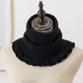 Detail of black knit thermal neck warmer featuring textured vertical wave patterns - Black