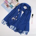 Navy blue cashmere-feel scarf featuring delicate plum blossom embroidery and fringe tassels - Sapphire Blue
