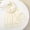 Close-up of soft off-white cashmere feel scarf with tassel texture on a table - 180-70cm / Beige