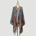 Detail shot of lake blue paisley embroidery on a retro scarf with delicate silk tassels - 176*70cm / Lake Blue