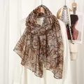 Lightweight voile scarf with vintage branch pattern print on casual white shirt - Camel