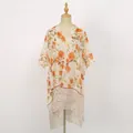 Detailed view of lightweight floral voile shawl with bright orange flower patterns - Orange