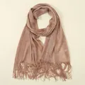 Close-up detail of metallic rose gold shimmer fabric with long tassel fringe edges - Champagne