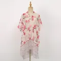 Detailed macro view of lightweight floral chiffon shawl with vibrant red flower patterns - Deep Pink