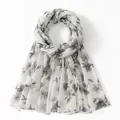 Detail of floral printed voile scarf with translucent fabric and gray flower patterns - White