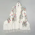 Detailed embroidery of colorful flowers on a soft off-white cashmere-like shawl with fringe - 190x75cm / White