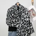 Detailed view of leopard print scarf texture with delicate fringe and thick cashmere feel - 4# Black and White