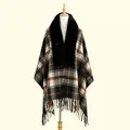 Detail of vintage plaid shawl with faux fur collar and fringe hem on a mannequin - One Size / Black
